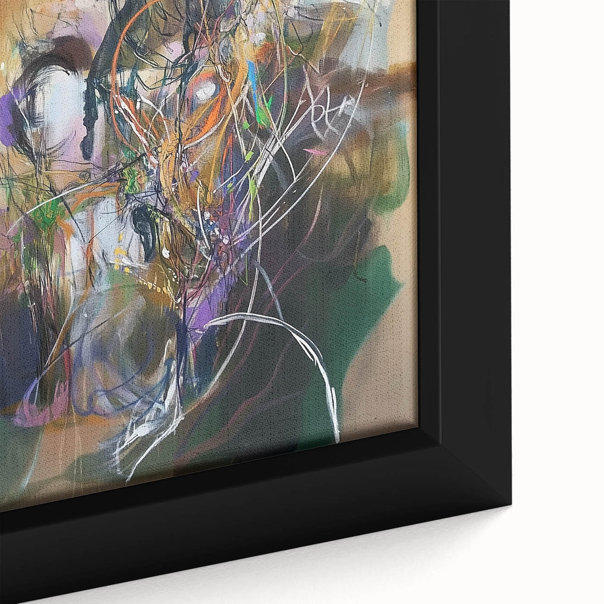 Close-up of a framed abstract canvas featuring vibrant splatter designs in shades of blue, orange, and yellow, showcasing modern art for contemporary decor.