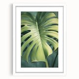 Framed wall art featuring a vibrant floral and botanical design with green leaves, set in a white mat, perfect for home decor and enhancing interior aesthetics.