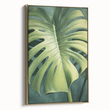 Framed canvas wall art displaying a floral and botanical design with gold accents, showcasing vibrant colors and intricate details, ideal for modern decor.