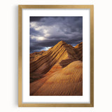 Desert landscape artwork framed in elegant gold with a cream mat, showcasing vibrant hues of orange and blue, perfect for home decor enhancement.