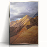 Framed acrylic landscape artwork depicting a serene desert scene, featuring warm hues of orange and yellow with a sleek silver frame, ideal for modern home decor.