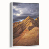 Framed canvas artwork depicting a stunning desert landscape scene with warm earth tones, featuring intricate details and vibrant colors, ideal for home decor.