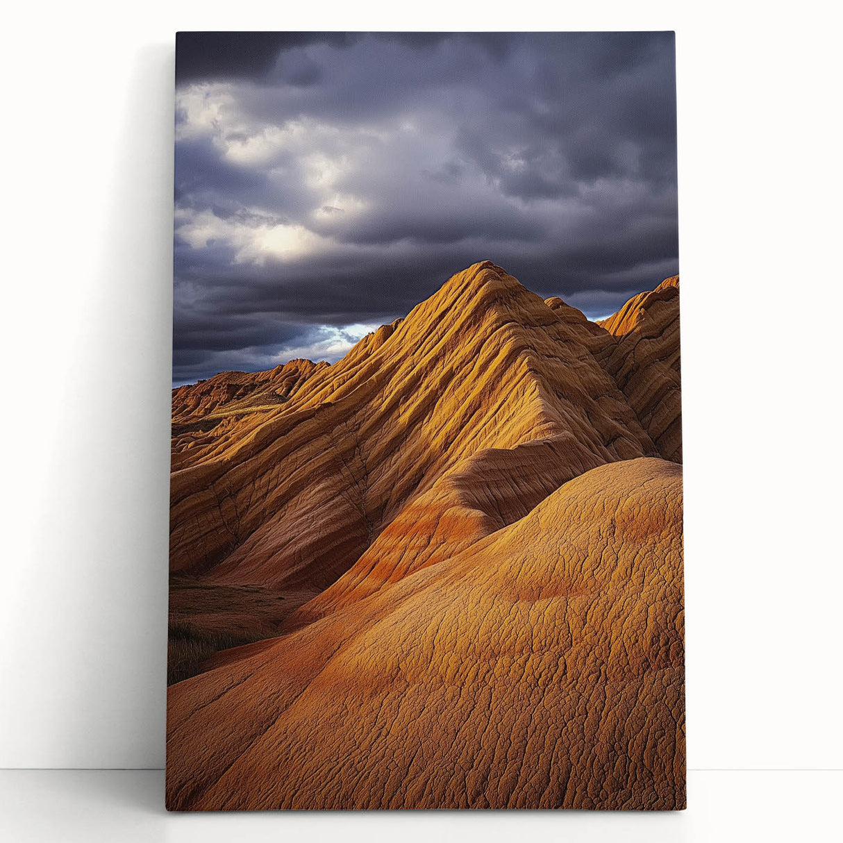 Stretched canvas artwork depicting a vibrant desert landscape with warm hues of orange and yellow, leaning against a neutral wall, perfect for home decor.