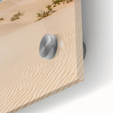 Close-up view of a vibrant acrylic print showcasing abstract sand dunes in a desert landscape, highlighting rich textures and colors for striking wall decor.