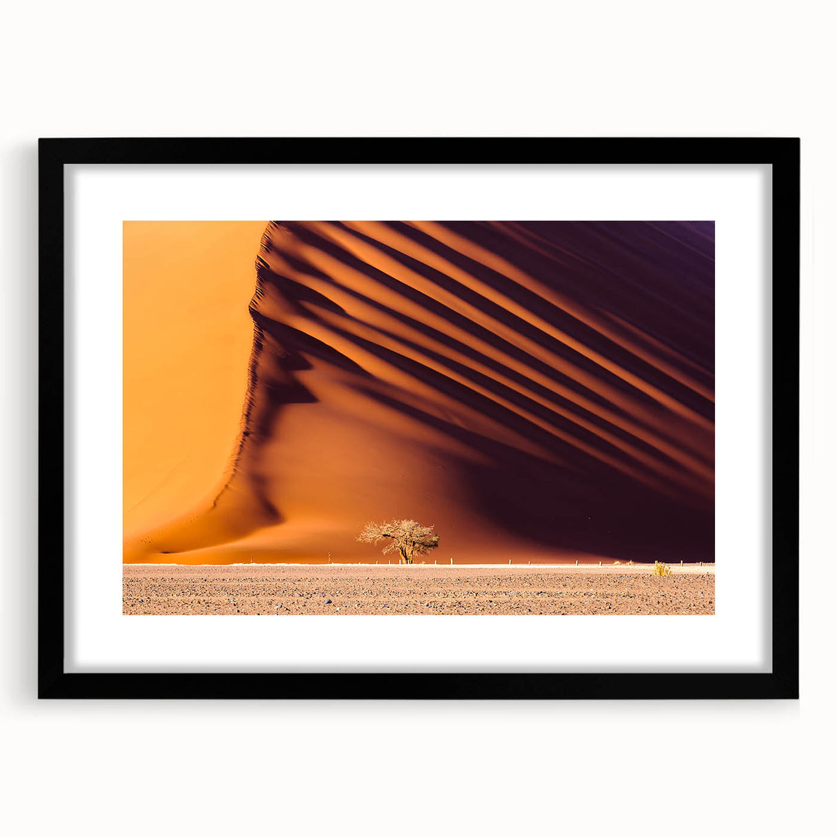 Extra large abstract art print of colorful, textured African scenery in a black frame, ideal for living room decor.