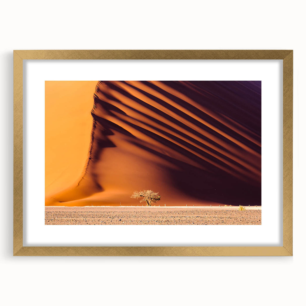Textured art depicting an abstract African landscape in earthy tones on a gold-framed canvas, ideal for bedroom art.