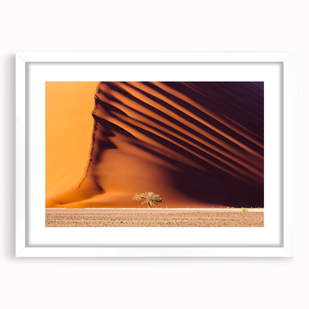 Extra large wall art depicting an abstract Namibian landscape in textured earth tones, framed with a white mat.