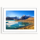 Abstract art print of a serene Indian landscape in soft blue and green hues, framed with a white mat.