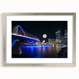 Abstract art print of Perth skyline in muted blue and gray tones on a framed silver mat.