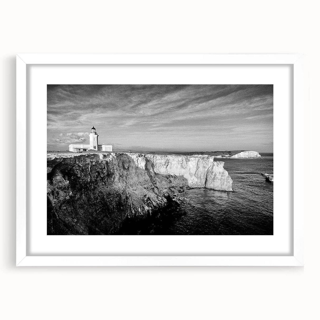 Textured abstract art print of a Caribbean scenery in muted blue and green tones, framed with a white mat.