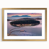 Abstract art print featuring a European scenery in muted gold and green tones, framed with a gold mat.