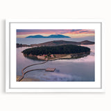 Textured abstract art print of a European scenery in muted earth tones on a white framed mat, suitable for bedroom decor.