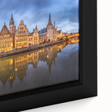 Close-up of a black framed canvas featuring a textured, colorful European scenery, ideal for living room decor.