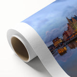 Art Deco poster of a European cityscape in muted pastel hues on rolled canvas.