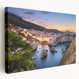 Landscape painting of a European village in Croatia on stretched canvas, featuring muted earth tones.