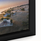 Close-up of a textured black wall art depicting a colorful European scenery on a framed canvas, ideal for living room decor.