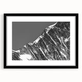 Extra large abstract art print of the French Alps in vibrant colors on textured canvas, framed in black.