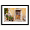 Colorful abstract art print of a Provencal landscape in vibrant hues, framed in black, ideal for living room decor.