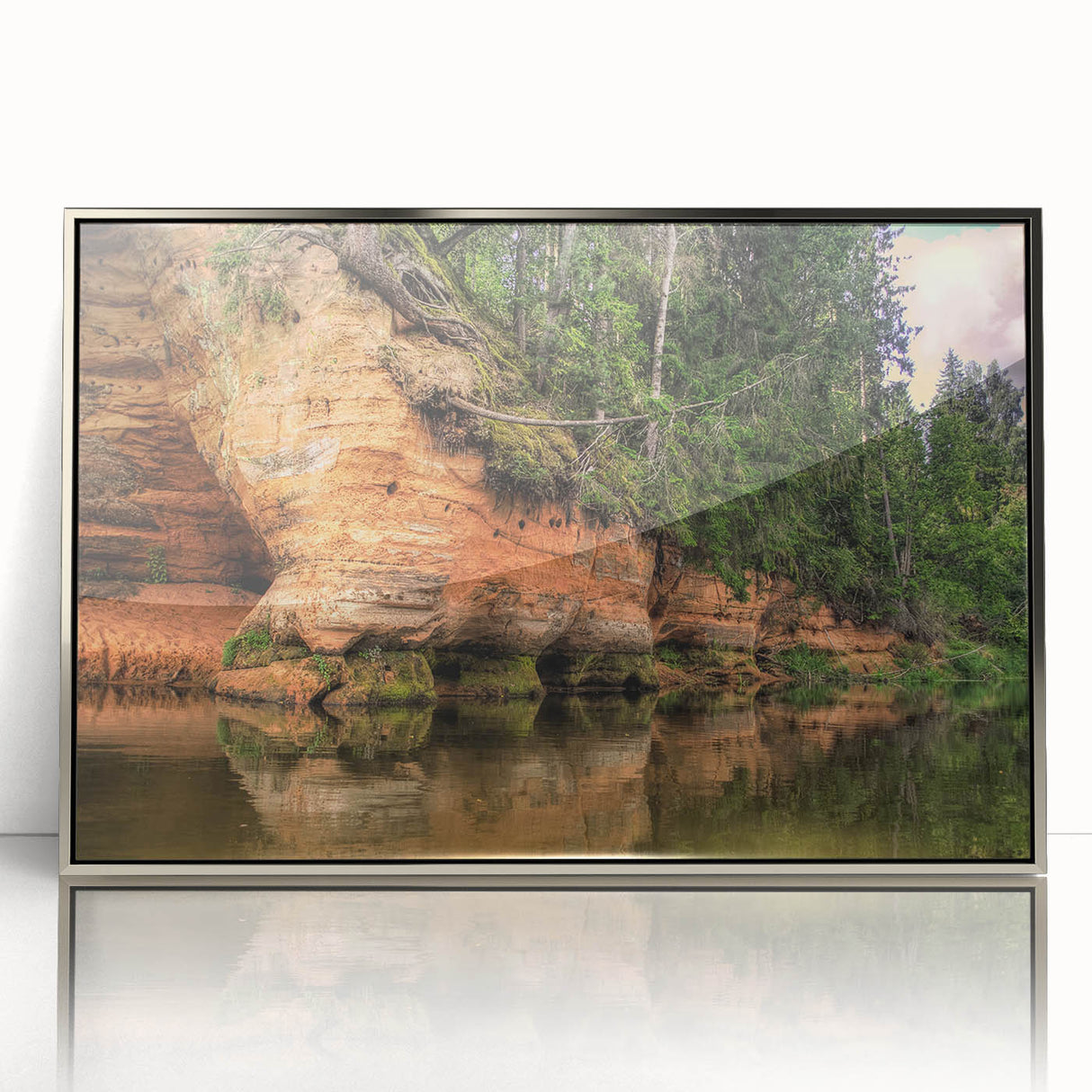 Large art print of a Latvian landscape, featuring muted earth tones on a silver-framed acrylic.