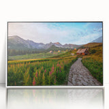 Mid-century modernist art depicting a Polish cityscape in muted gray and blue tones, acrylic print framed in white.