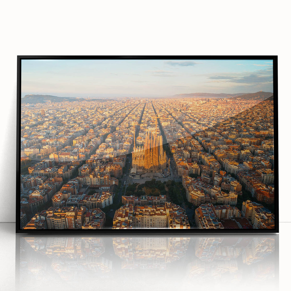 Large abstract wall art featuring a Barcelona cityscape in muted gray and blue tones on a framed acrylic panel.