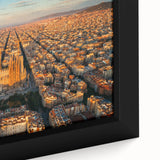 Black wall art depicting a textured Barcelona cityscape in vibrant colors on a framed canvas, ideal for living room decor.
