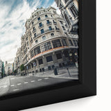Black wall art featuring a textured, colorful Madrid cityscape on a large framed canvas, ideal for living room decor.