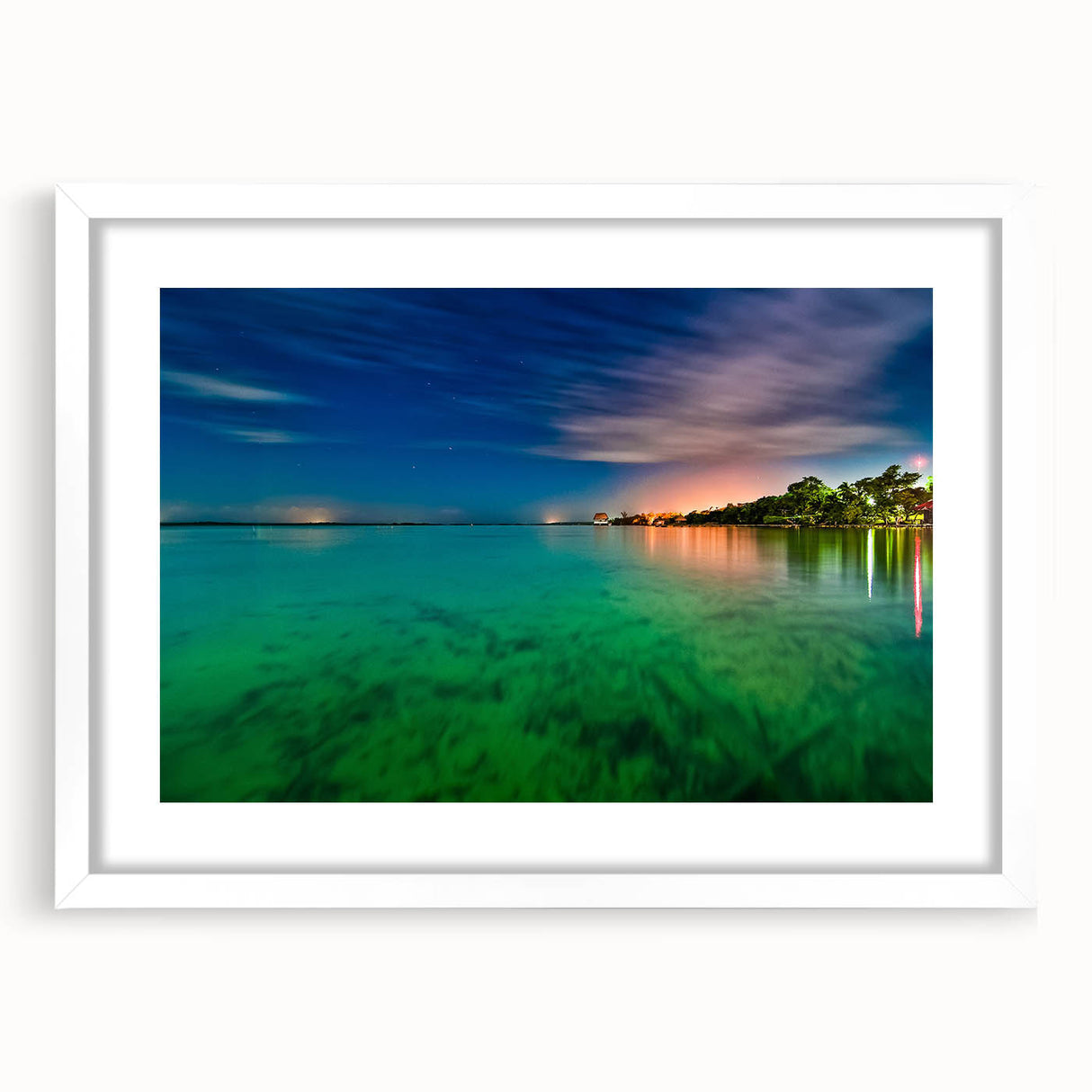 Abstract art print of Yucatan scenery in muted green and blue tones, framed with a white mat.