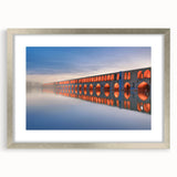 Textured abstract art print depicting a Middle Eastern scenery in muted earth tones on a framed canvas.