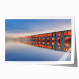 Extra large rolled print featuring a scenic view of a Middle Eastern landscape, with muted earth tones.