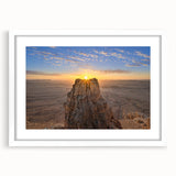 Abstract art print of a Middle Eastern cityscape in muted earth tones on a framed white mat, suitable for dining room decor.