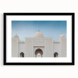 Abstract art print of a colorful, textured scenery, framed in black, ideal for living room decor.