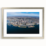 Textured abstract art print of San Diego scenery in silver frame with mat, featuring muted earth tones.