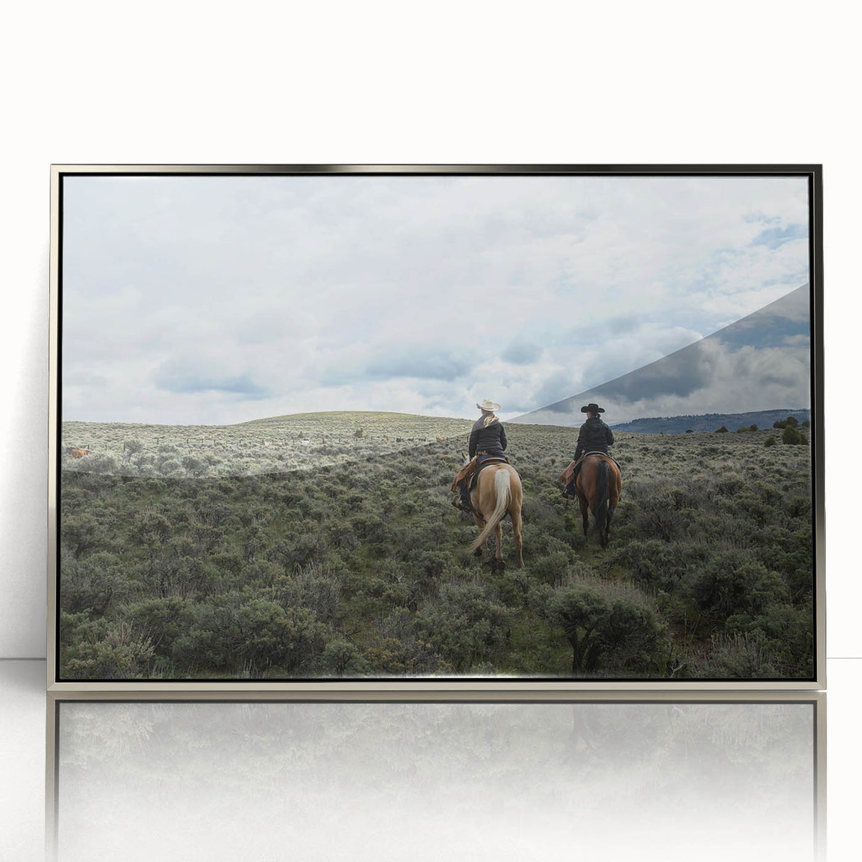 Large art print of Montana scenery in muted earth tones, framed in silver acrylic, suitable for modern nursery decor.