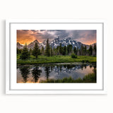 Abstract art print of the Grand Tetons in muted earth tones on a framed white mat, ideal for dining room decor.