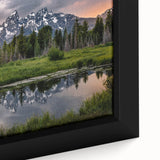 Extra large framed canvas featuring a textured depiction of the Grand Tetons in Wyoming with a black border and colorful art…