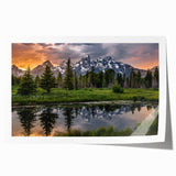 Rolled print of the Grand Tetons with lush greenery and rugged mountains, in soft earth tones.