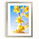 Textured abstract art print in vibrant green and yellow hues, framed in silver, ideal for bedroom wall decor.