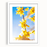 Abstract art print featuring a spring motif in soft green and pink tones on a white framed canvas.