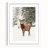 Abstract art print depicting winter scenes in cool blue and white tones, framed with a white mat.