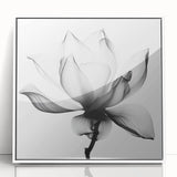 Framed acrylic artwork showcasing a vibrant abstract floral design in white, perfect for modern home decor, adding elegance and color to any room.