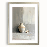 Abstract minimalist wall art framed in a sleek silver frame, featuring soft neutral tones and geometric shapes, perfect for modern home decor.