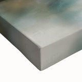 Close-up of a stretched canvas artwork depicting an abstract landscape with vibrant colors and textured detail, ideal for modern home decor and artistic interiors.