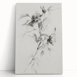 Abstract floral design on a stretched canvas, featuring vibrant colors of pink, blue, and green, elegantly leaning against a neutral wall, perfect for modern decor.