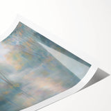 Abstract landscape rolled print showcasing vibrant hues of blue and orange with a textured finish, elegantly packaged in a protective cardboard tube for easy display.