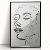 Abstract figurative wall art in a sleek black frame, showcasing vibrant colors and dynamic shapes, perfect for modern decor and artistic expression.