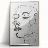 Framed abstract figurative wall art featuring a gold and black color scheme, showcasing dynamic shapes and textures, perfect for modern home decor.