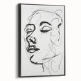 Framed abstract figurative wall art in a sleek black frame, showcasing a dynamic interplay of colors and shapes, perfect for modern decor. This artistic piece adds a contemporary touch to any room setting.