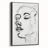 Framed abstract figurative wall art in a sleek black frame, showcasing a dynamic interplay of colors and shapes, perfect for modern decor. This artistic piece adds a contemporary touch to any room setting.