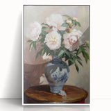 Framed acrylic artwork showcasing vibrant abstract floral designs in shades of pink, blue, and green, set against a sleek white background, perfect for modern decor.